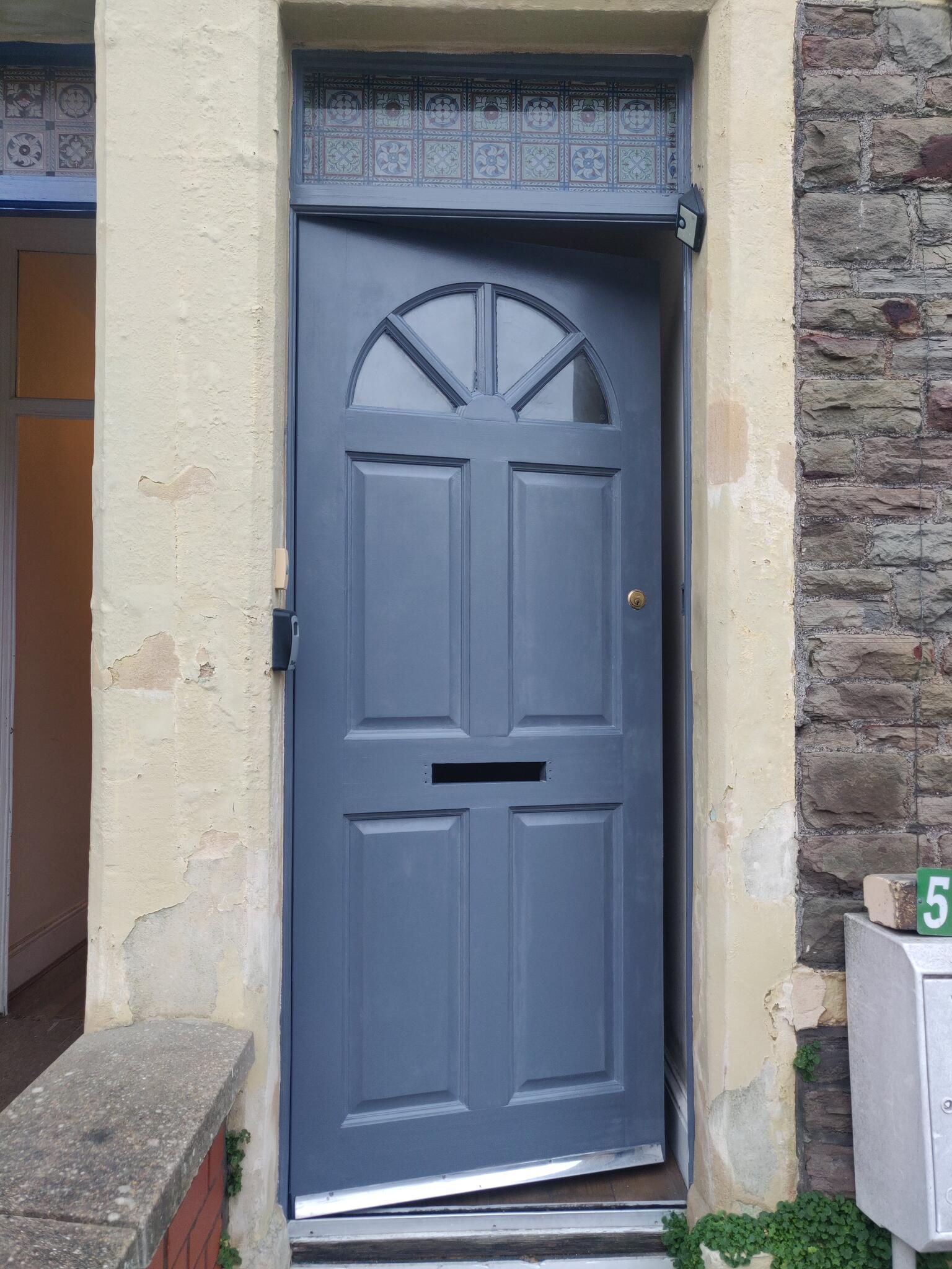 Window and shutters repainted with crisp precision