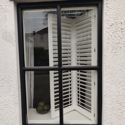 Front elevation — window and door refinished in black
